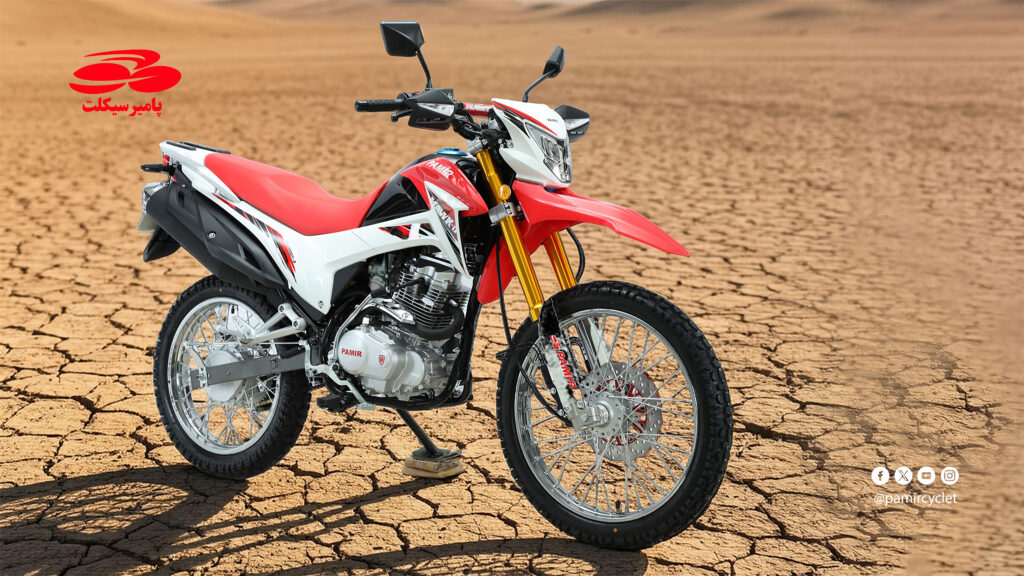 Red and white Pamir GY 200 CC motorcycle photographed in an arid landscape